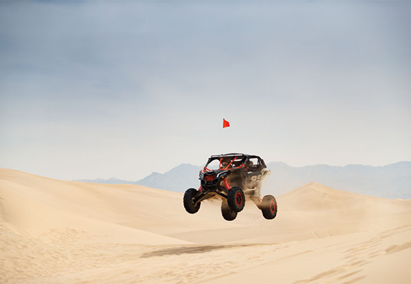 Квадроцикл BRP Can-Am Maverick X3 Xrs Turbo RR 2021 модельного року над землею